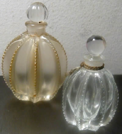 Flowers of Devonshire Perfume Bottles By Mary Dunhill That Are Close Copies of The R. Lalique Gregoire Perfume Bottle and also Close Copies of the Original R. Lalique Flowers of Devonshire Perfume Bottle that Lalique made for Mary Dunhill Flowers of Devonshire Perfume Bottles By Mary Dunhill That Are Close Copies of The R. Lalique Gregoire Perfume Bottle and also Close Copies of the Original R. Lalique Flowers of Devonshire Perfume Bottle that Lalique made for Mary Dunhill