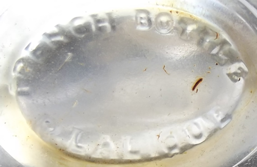 Worth Disk Shaped Clear and Frosted Perfume Bottle With Stars and Moon Stopper and the Rene Lalique Signature Perfume Bottle R.Lalique